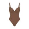 SKIMS ULTIMATE BODY PUSH-UP THONG BODYSUIT SKIMS ULTIMATE BODY PUSH-UP THONG BODYSUIT